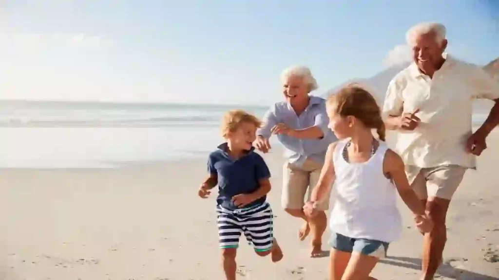 2 Grandparents kids beach Shutterstock ©Monkey Business Images