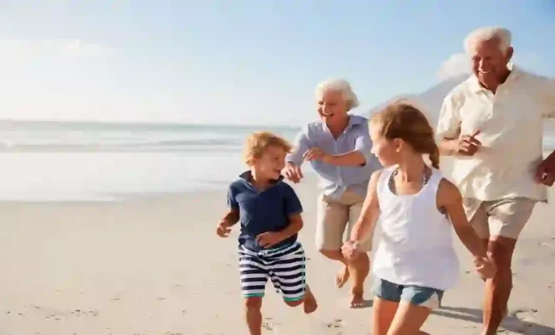 2 Grandparents kids beach Shutterstock ©Monkey Business Images